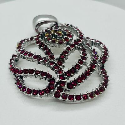 Lot 140: NF 925 Thailand Red Rose Pendant of Garnet Chips