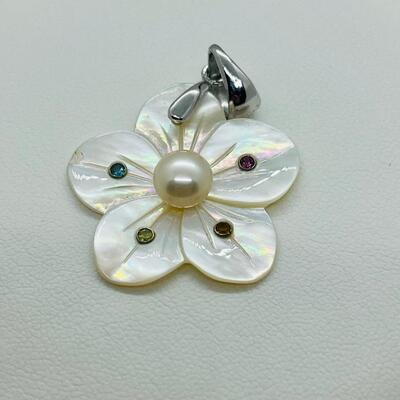 Lot 141: Mother of Pearl Flower with Cultured Pearl Center, Inset Gemstones, & Sterling Bail