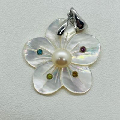 Lot 141: Mother of Pearl Flower with Cultured Pearl Center, Inset Gemstones, & Sterling Bail
