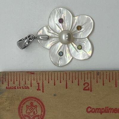 Lot 141: Mother of Pearl Flower with Cultured Pearl Center, Inset Gemstones, & Sterling Bail