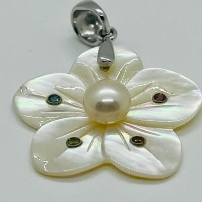 Lot 141: Mother of Pearl Flower with Cultured Pearl Center, Inset Gemstones, & Sterling Bail