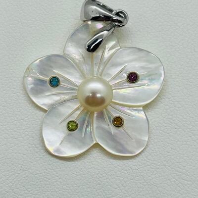 Lot 141: Mother of Pearl Flower with Cultured Pearl Center, Inset Gemstones, & Sterling Bail