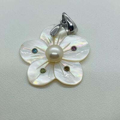 Lot 141: Mother of Pearl Flower with Cultured Pearl Center, Inset Gemstones, & Sterling Bail