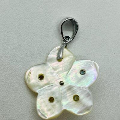 Lot 141: Mother of Pearl Flower with Cultured Pearl Center, Inset Gemstones, & Sterling Bail