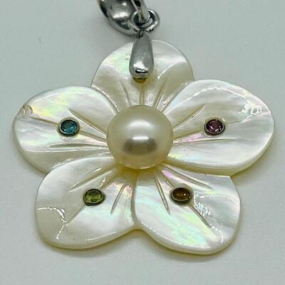 Lot 141: Mother of Pearl Flower with Cultured Pearl Center, Inset Gemstones, & Sterling Bail