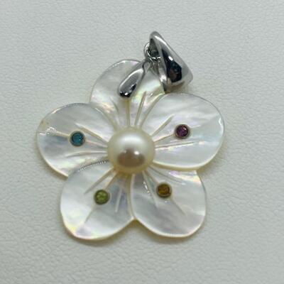 Lot 141: Mother of Pearl Flower with Cultured Pearl Center, Inset Gemstones, & Sterling Bail