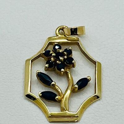 Lot 151: Saia 14k Yellow Gold Pendant with Sapphire Flower Center