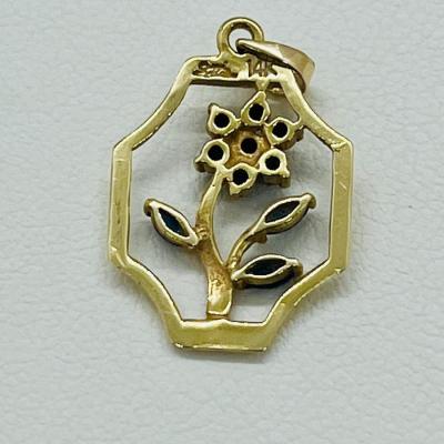 Lot 151: Saia 14k Yellow Gold Pendant with Sapphire Flower Center