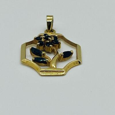 Lot 151: Saia 14k Yellow Gold Pendant with Sapphire Flower Center