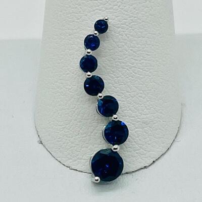 Lot 155: 10k White Gold Blue Sapphire "Journey" Pendant