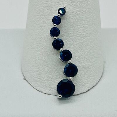 Lot 155: 10k White Gold Blue Sapphire "Journey" Pendant