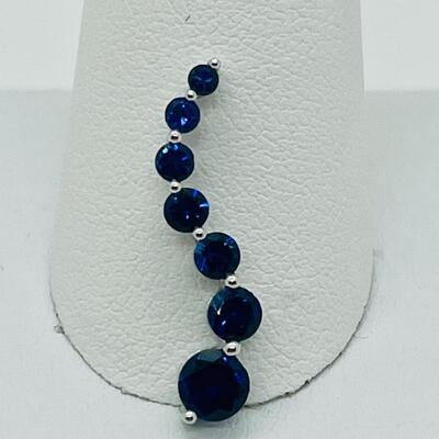 Lot 155: 10k White Gold Blue Sapphire "Journey" Pendant