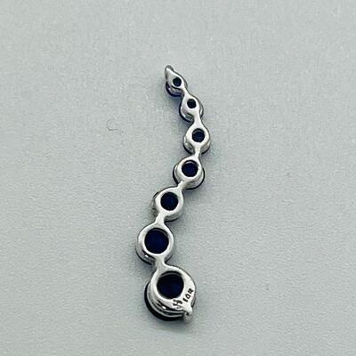 Lot 155: 10k White Gold Blue Sapphire "Journey" Pendant