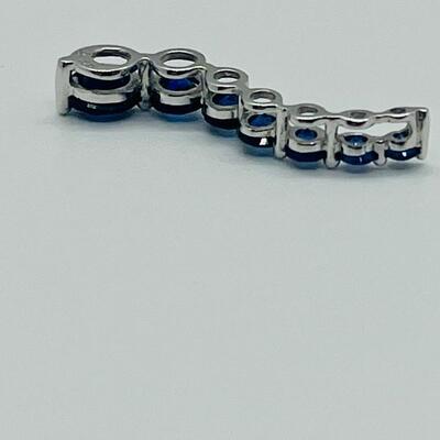 Lot 155: 10k White Gold Blue Sapphire "Journey" Pendant