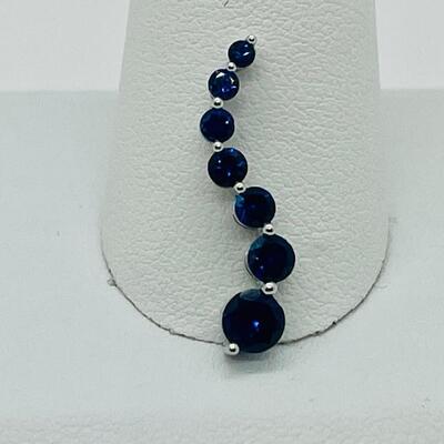 Lot 155: 10k White Gold Blue Sapphire "Journey" Pendant