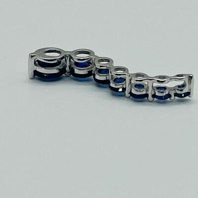 Lot 155: 10k White Gold Blue Sapphire "Journey" Pendant