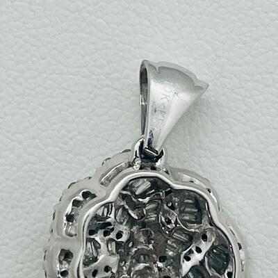 Lot 159:  5g 10k White Gold Pendant Covered in Round & Baguette White Diamonds