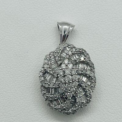 Lot 159:  5g 10k White Gold Pendant Covered in Round & Baguette White Diamonds