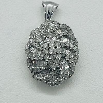Lot 159:  5g 10k White Gold Pendant Covered in Round & Baguette White Diamonds