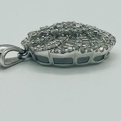 Lot 159:  5g 10k White Gold Pendant Covered in Round & Baguette White Diamonds