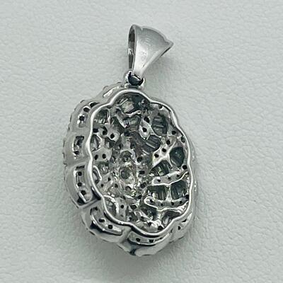 Lot 159:  5g 10k White Gold Pendant Covered in Round & Baguette White Diamonds