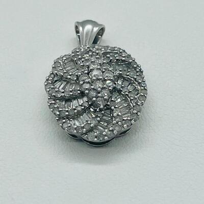Lot 159:  5g 10k White Gold Pendant Covered in Round & Baguette White Diamonds