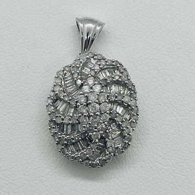 Lot 159:  5g 10k White Gold Pendant Covered in Round & Baguette White Diamonds