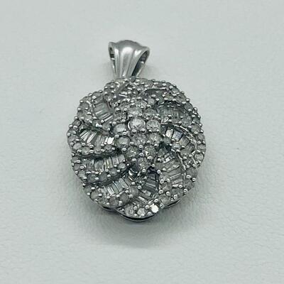 Lot 159:  5g 10k White Gold Pendant Covered in Round & Baguette White Diamonds