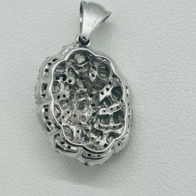 Lot 159:  5g 10k White Gold Pendant Covered in Round & Baguette White Diamonds