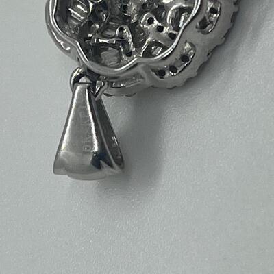 Lot 159:  5g 10k White Gold Pendant Covered in Round & Baguette White Diamonds