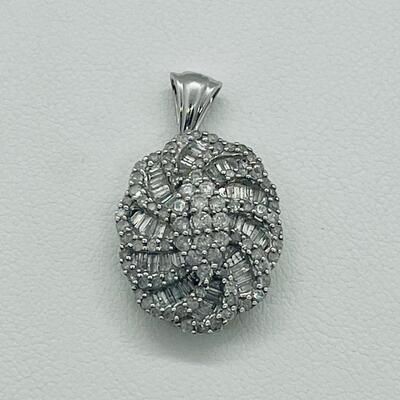 Lot 159:  5g 10k White Gold Pendant Covered in Round & Baguette White Diamonds