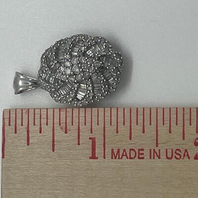 Lot 159:  5g 10k White Gold Pendant Covered in Round & Baguette White Diamonds