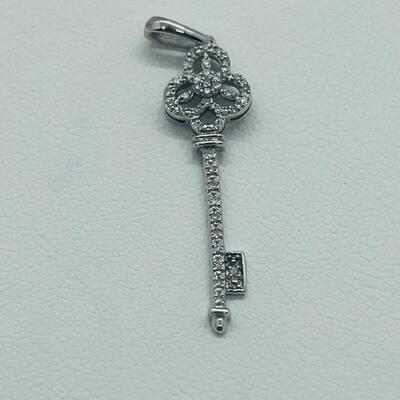 Lot 174: 14k White Gold Diamond Key Pendant