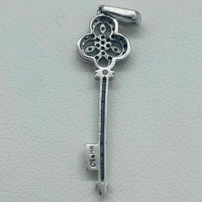 Lot 174: 14k White Gold Diamond Key Pendant