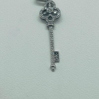Lot 174: 14k White Gold Diamond Key Pendant