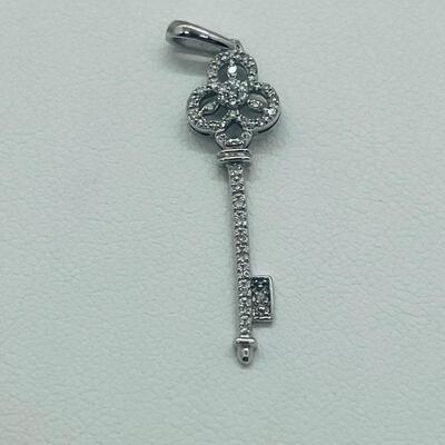 Lot 174: 14k White Gold Diamond Key Pendant