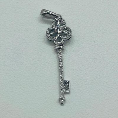 Lot 174: 14k White Gold Diamond Key Pendant