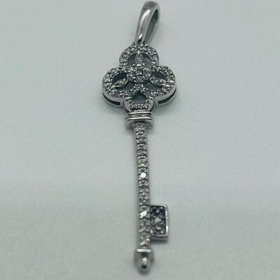 Lot 174: 14k White Gold Diamond Key Pendant
