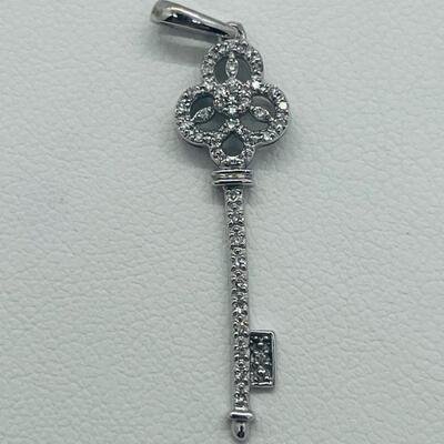 Lot 174: 14k White Gold Diamond Key Pendant