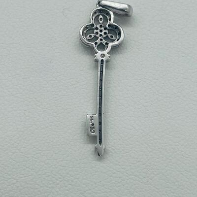 Lot 174: 14k White Gold Diamond Key Pendant