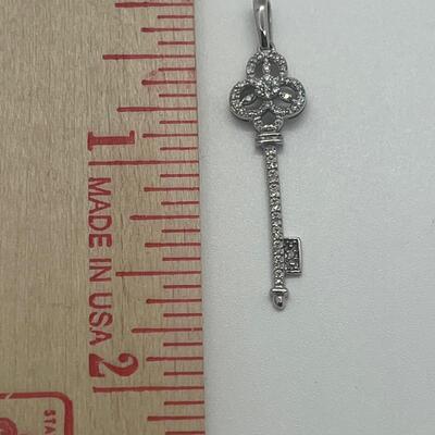 Lot 174: 14k White Gold Diamond Key Pendant