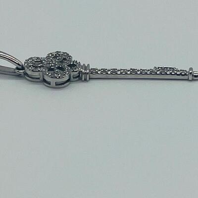 Lot 174: 14k White Gold Diamond Key Pendant