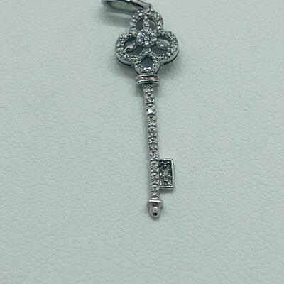 Lot 174: 14k White Gold Diamond Key Pendant