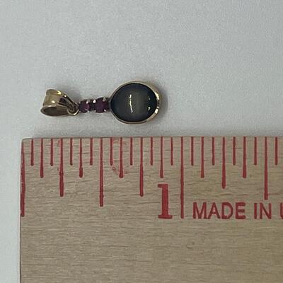 Lot 177: 18k Yellow Gold Pendant with Black Diamond & Pink Diamond Chips