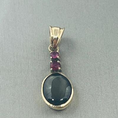Lot 177: 18k Yellow Gold Pendant with Black Diamond & Pink Diamond Chips
