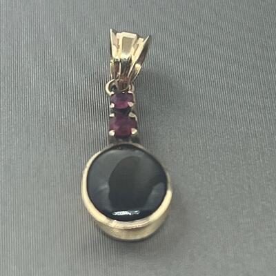 Lot 177: 18k Yellow Gold Pendant with Black Diamond & Pink Diamond Chips