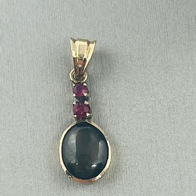Lot 177: 18k Yellow Gold Pendant with Black Diamond & Pink Diamond Chips