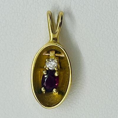 Lot 158: Vintage 14k Yellow Gold Pendant with Diamond Chip & Natural Ruby