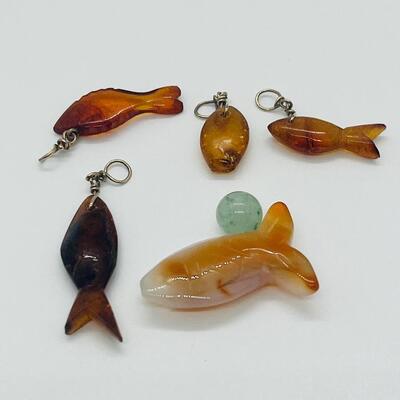 Lot 181: Amber & Jade Fish Charms