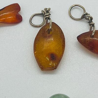 Lot 181: Amber & Jade Fish Charms